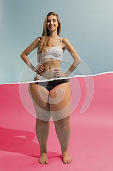 Smiling young woman with slim, relief upper body and fat legs with cellulite on the bottom. Conceptual design