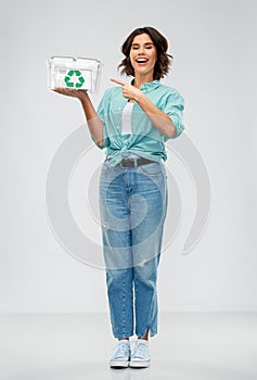 Smiling young woman sorting metallic waste