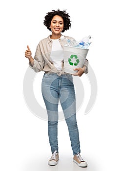 smiling young woman sorting plastic waste