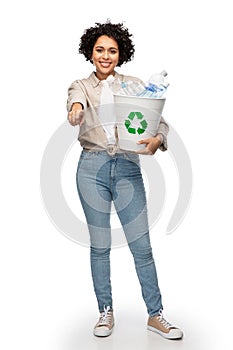 smiling young woman sorting plastic waste