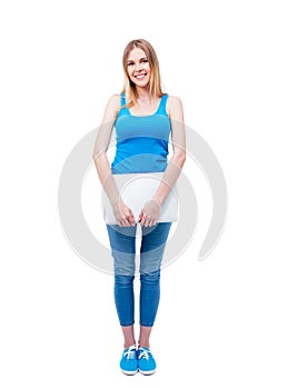 Smiling young woman standing with laptop