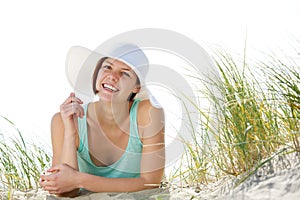 Smiling young woman with sun hat