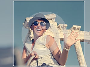 Smiling young woman take a selfie photo on summer vacation