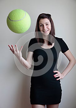 Smiling young woman toss bÐ°ll