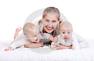 Smiling young woman with two baby boys