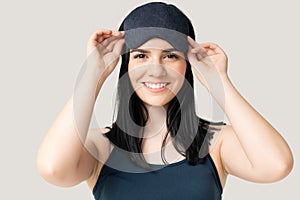 Smiling Young Woman Wearing Eye Mask