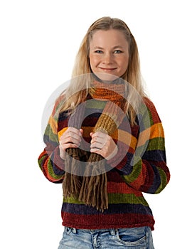 Smiling young woman wearing striped sweater