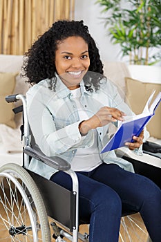 Smiling young woman in wheelchair