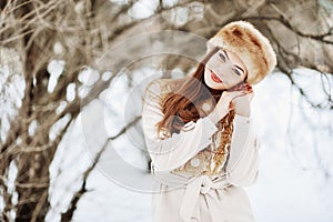 Smiling young woman in wintertime outdoor