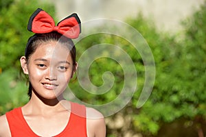 A Smiling Youthful Asian Female