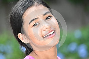 An A Smiling Youthful Filipina Female