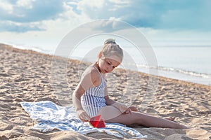 Smilling little girl eating watermelon. Summer, hollidays and travel concept