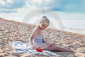 Smilling little girl eating watermelon. Summer, hollidays and travel concept photo