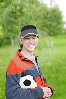 Smilling man with soccer ball