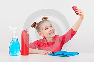 Smilng girl with multicolored cleaners on the white background