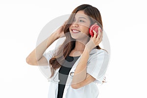 A smily woman doctor wearing a red headphones with a sthethoscope on her neck photo