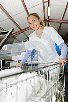 Smily woman working at laundry