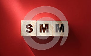 SMM abbreviation on wood cubes. Social media marketing. Business concept