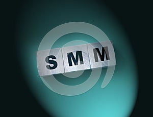 SMM abbreviation on wood cubes. Social media marketing. Business concept