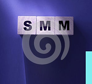 SMM abbreviation on wood cubes. Social media marketing. Business concept