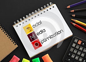 SMO - Social Media Optimization acronym on notepad, internet concept background