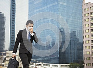 Smog in the city.businessman walking on street