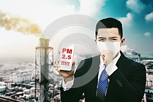 Smog in city. man showing PM 2.5 alart in mobile phone