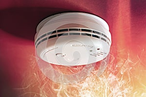 Smoke alarm detector and interlinked fire alarm in action background photo
