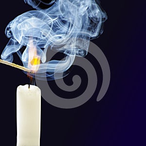 Smoke from a burning candle and matches