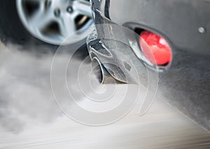 Smoke car pipe exhaust,Smoke from a car producing pollution