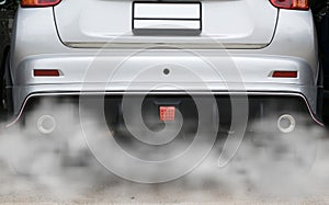 Smoke from a car producing pollution,smoke car pipe exhaust photo