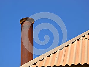 Smoke chimney on slate roof