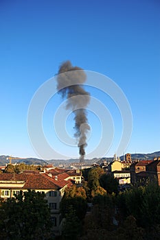 Smoke column in Turin, Italy
