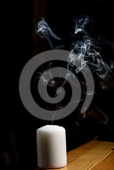 Smoke coming from a blown out candle
