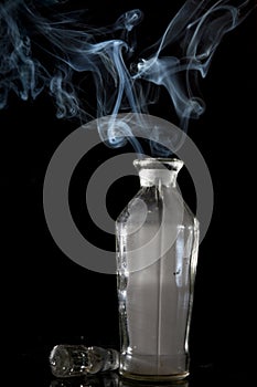 Smoke coming out of a glass bottle