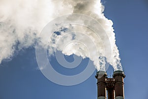 smoke coming out of pipes into the clear blue sky, ecology problems