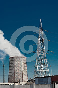 Smoke cooling tower pollution of the surrounding air environment of the atmosphere from the industrial plant and power lines high