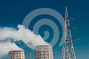 Smoke cooling tower pollution of the surrounding air environment of the atmosphere from the industrial plant and power lines high