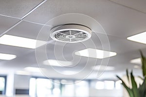 Smoke Detector on Clean Office Ceiling