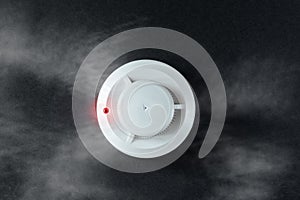 Smoke detector and fire detector on a black background.Fire Alarm flat lay