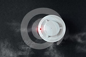 Smoke detector and fire detector on a black background.Fire Alarm flat lay