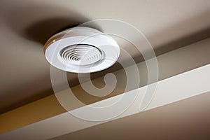 smoke detectors installed on a ceiling