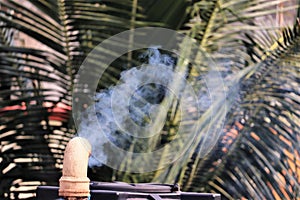 Smoke emerging out of a chimney of a house causing pollution