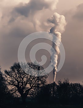 Smoke emission from chimney. Cause of global warming. Conception of air pollution and smog issue. Factory steam contaminate