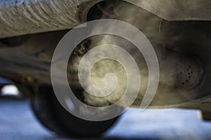 Smoke from the exhaust pipe of the car in the winter cold season