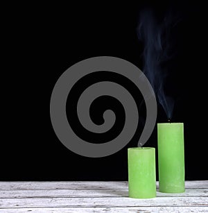 Smoke and extinct green candles