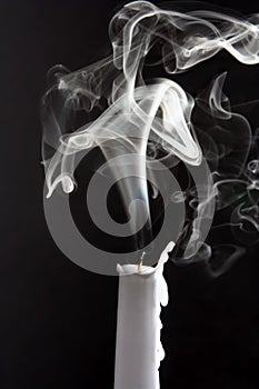 The smoke of an extinguished candle