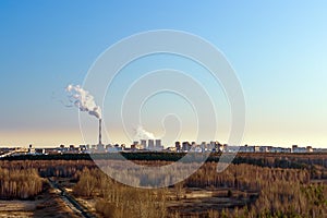 Smoke from the factory chimneys. concept of environmental pollution. city landscape in the evening