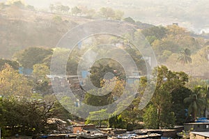 Smoke and fog covering the green forests and trees of the outskirts of the Sanjay Gandhi National Park