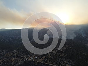 Smoke of a forest fire obscures the sun